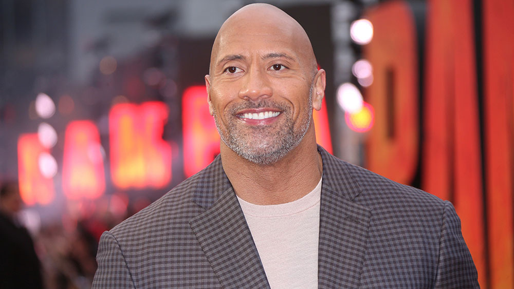 Mandatory Credit: Photo by Joel C Ryan/Invision/AP/REX/Shutterstock (9624970ac) Actor Dwayne Johnson poses for photographers upon arrival at the premiere of the film 'Rampage' in London Britain Rampage Premiere, London, United Kingdom - 11 Apr 2018