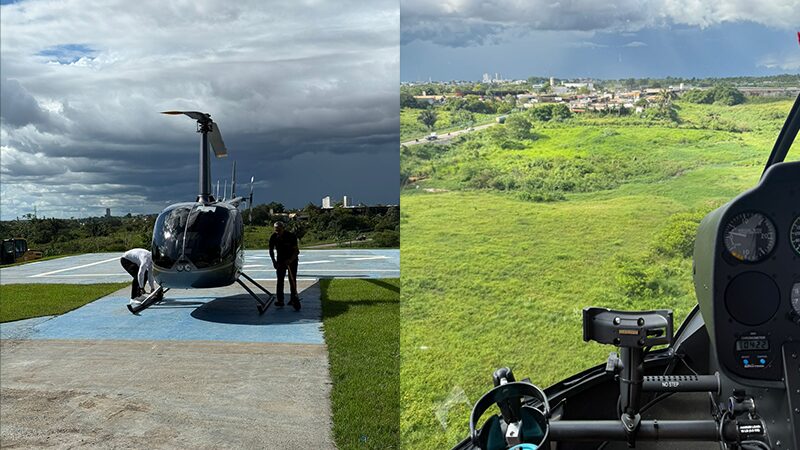 Duas imagens: um helicóptero no heliponto com pessoas sob céu nublado e vista aérea de campos verdes da cabine.