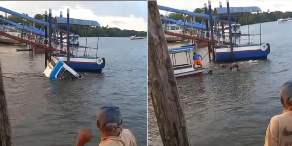 Homem em um píer observando barcos em um rio durante o dia.